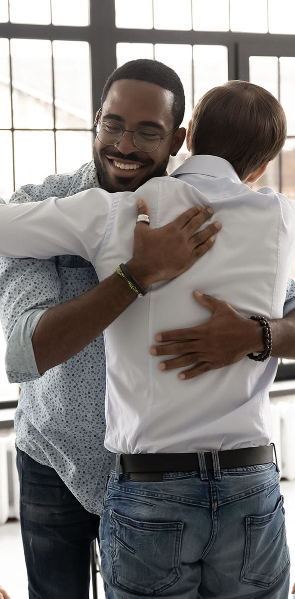 two men supporting each other