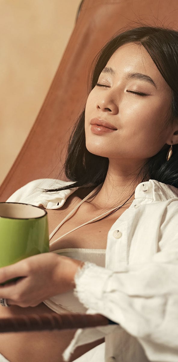 woman relaxing drinking tea