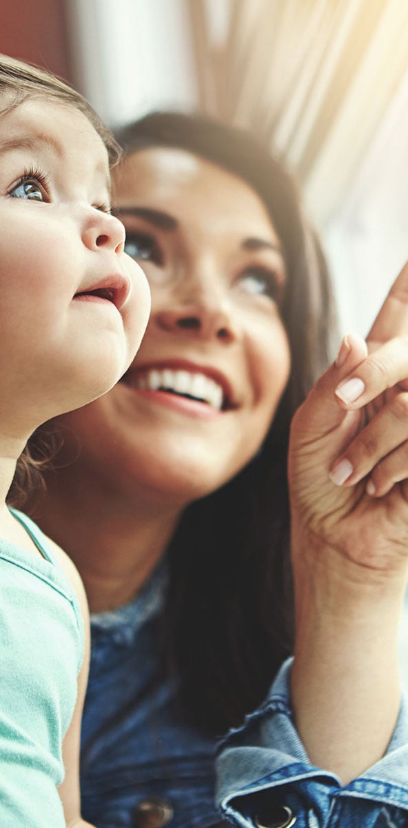 mother and child pointing out window