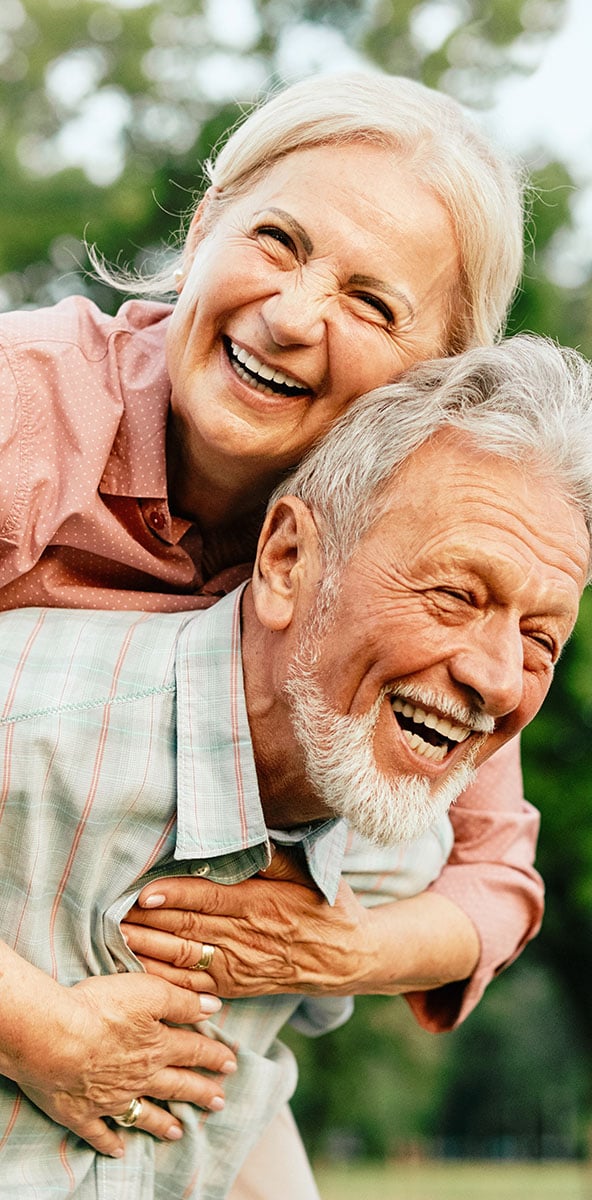 elder couple laughing together