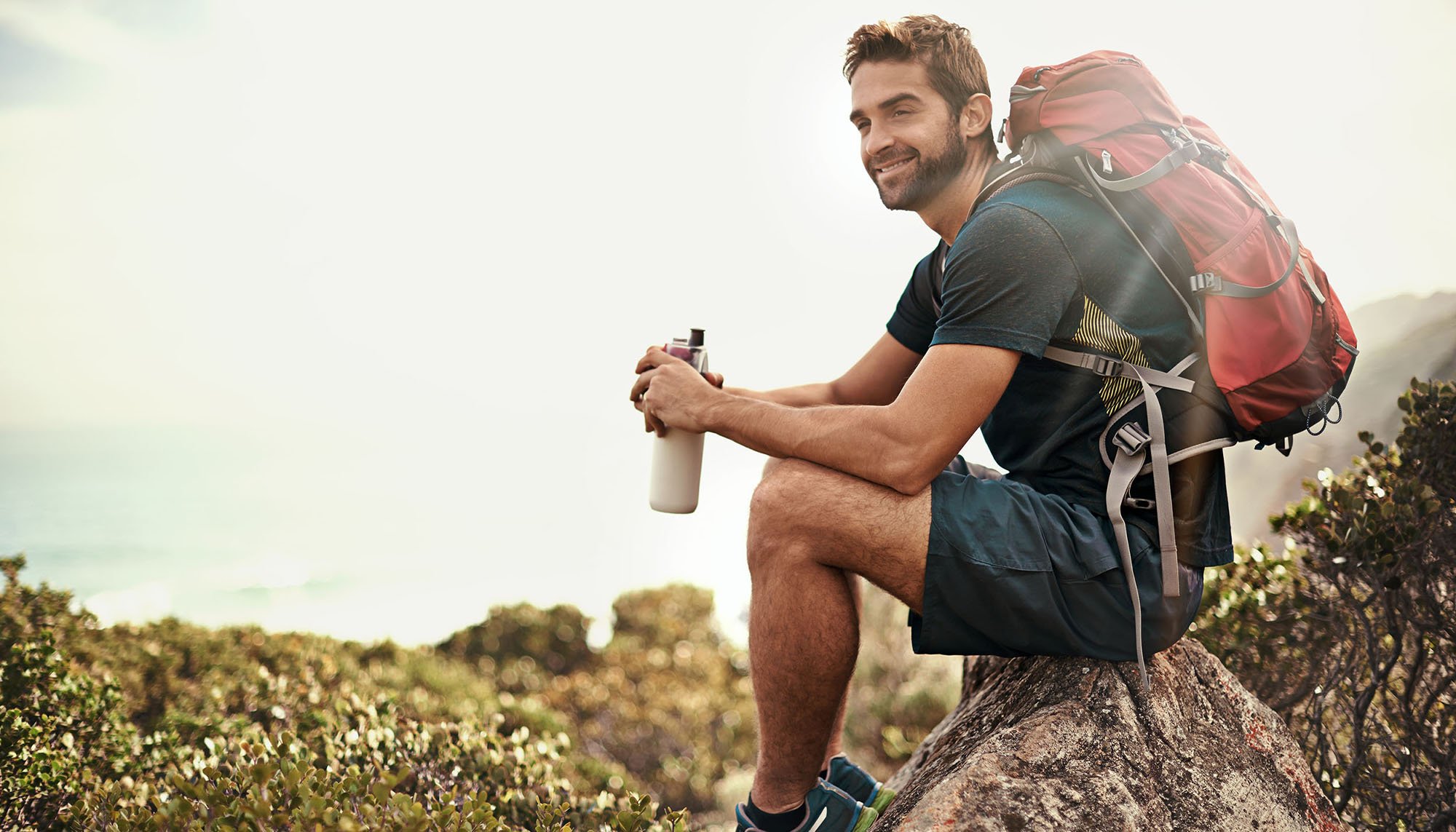 hiker sitting on a rock