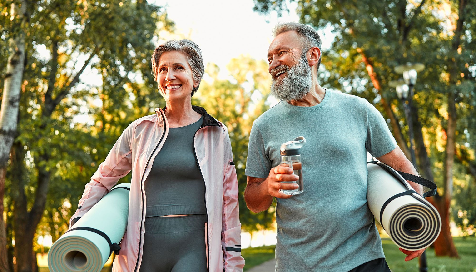 elder couple doing yoga