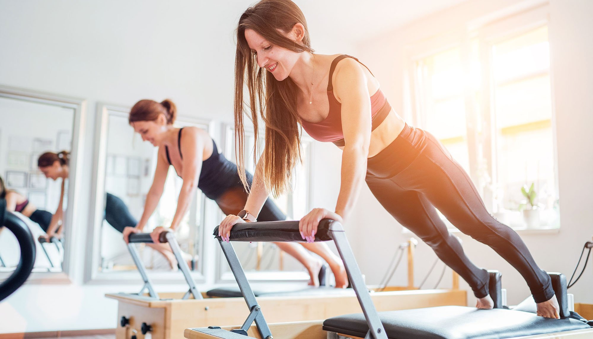 happy woman working out at gym