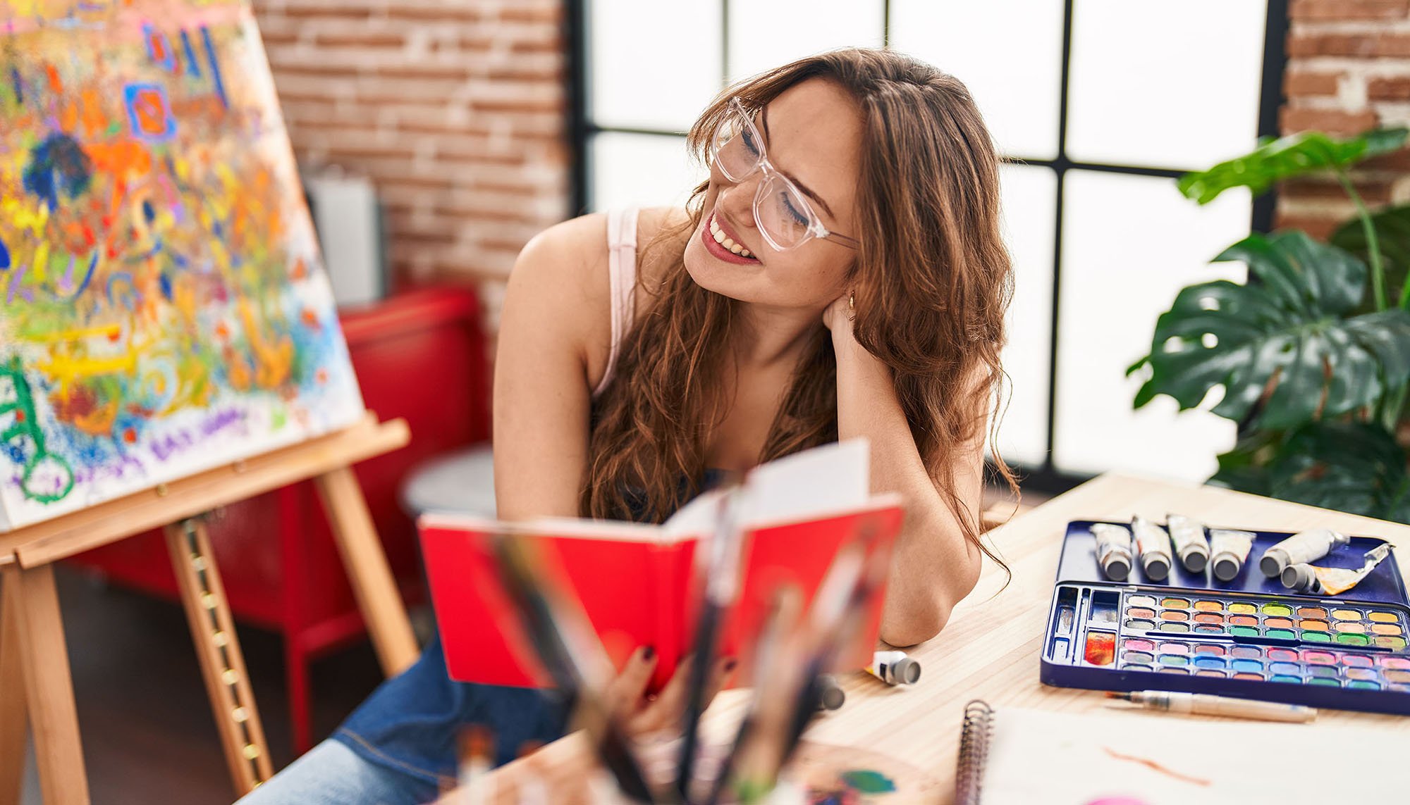 woman reading book in art room