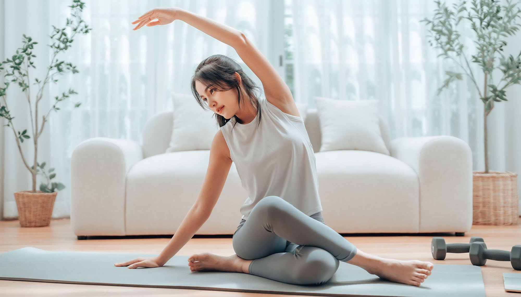 woman stretching in living room
