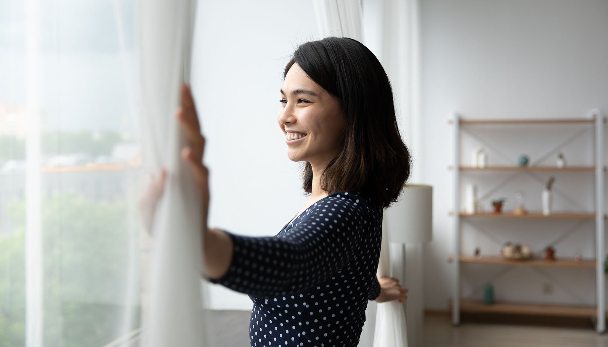 happy woman looking out window