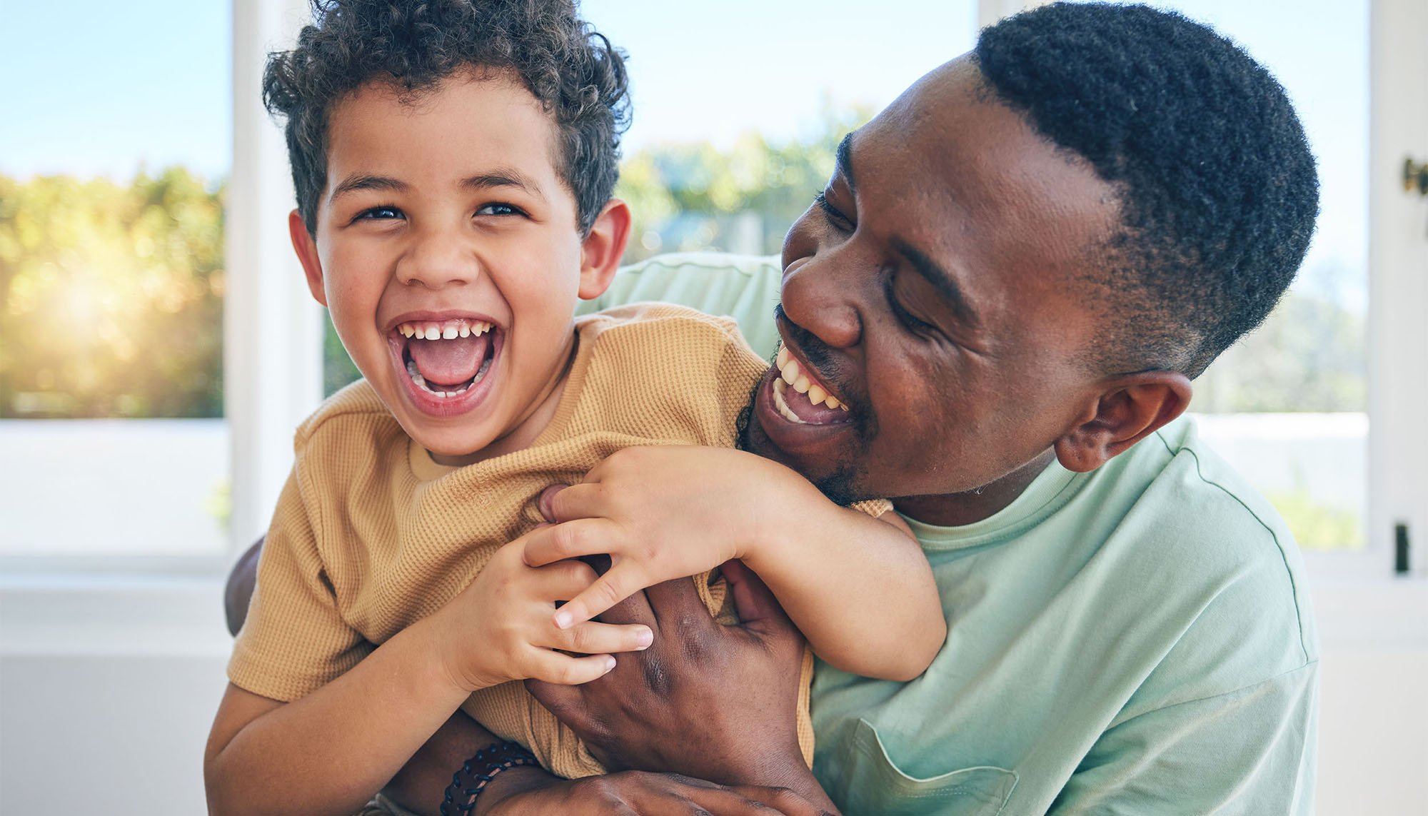 african man and son laughing