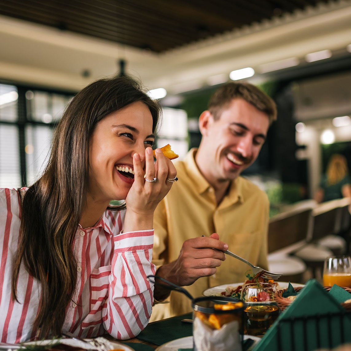couple at restarant laughing