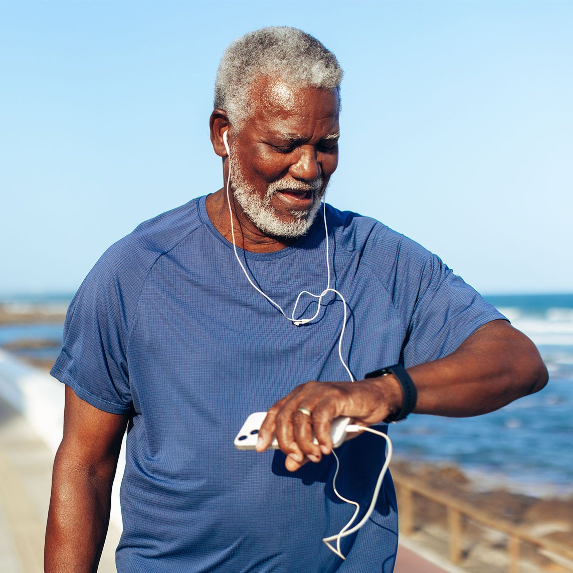 african man checking time on watch