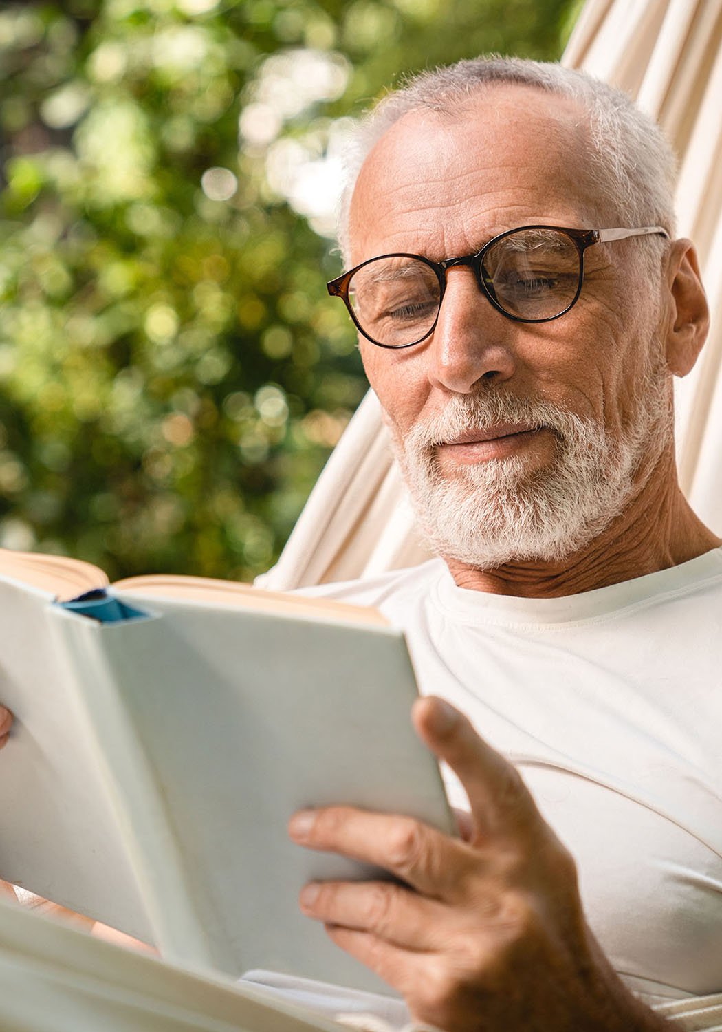 elder man reading a book