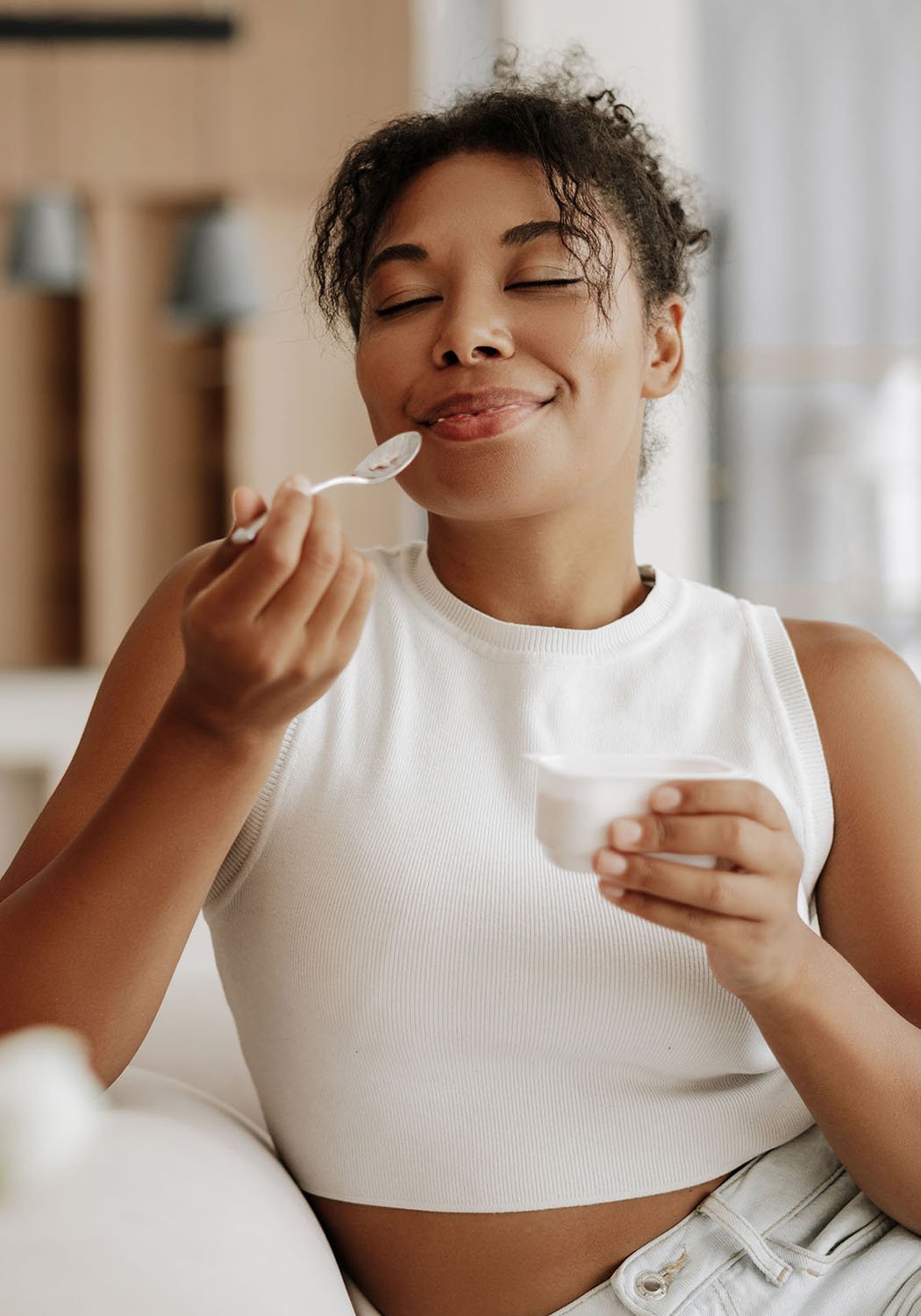 woman eating yogurt